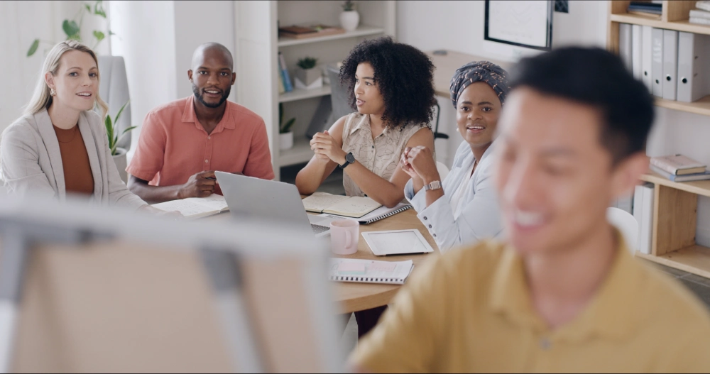 Group of marketing professionals working together in an office setting