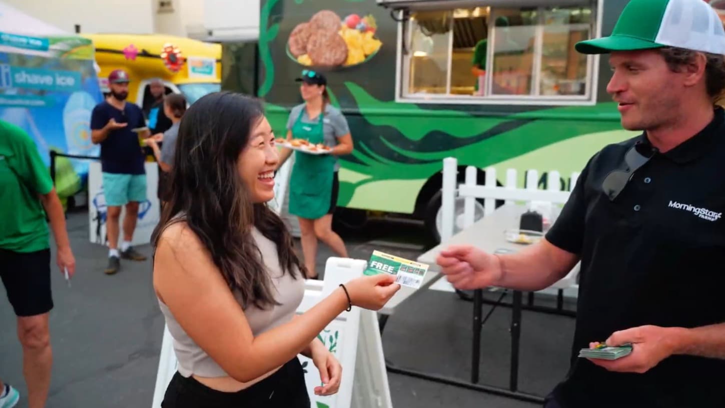 MorningStar Farms brand ambassador handing out a product coupon