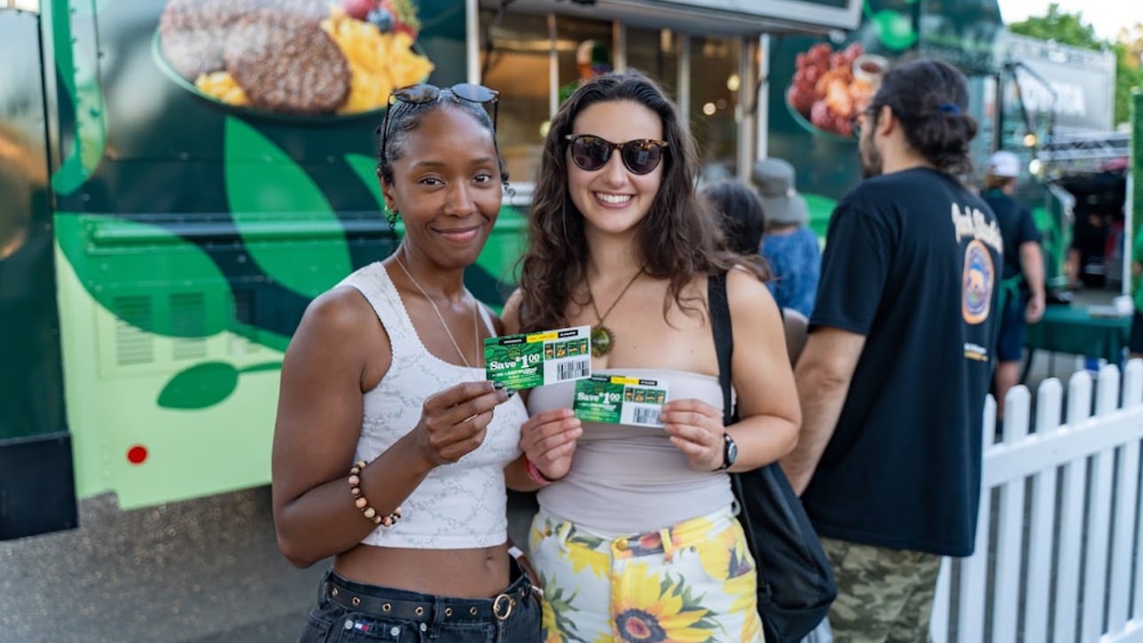 Consumers holding MorningStar Farms product coupons at the food truck